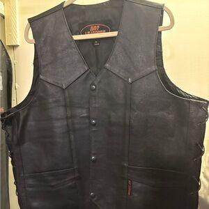 Black leather bikers vest. Laces up the sides.